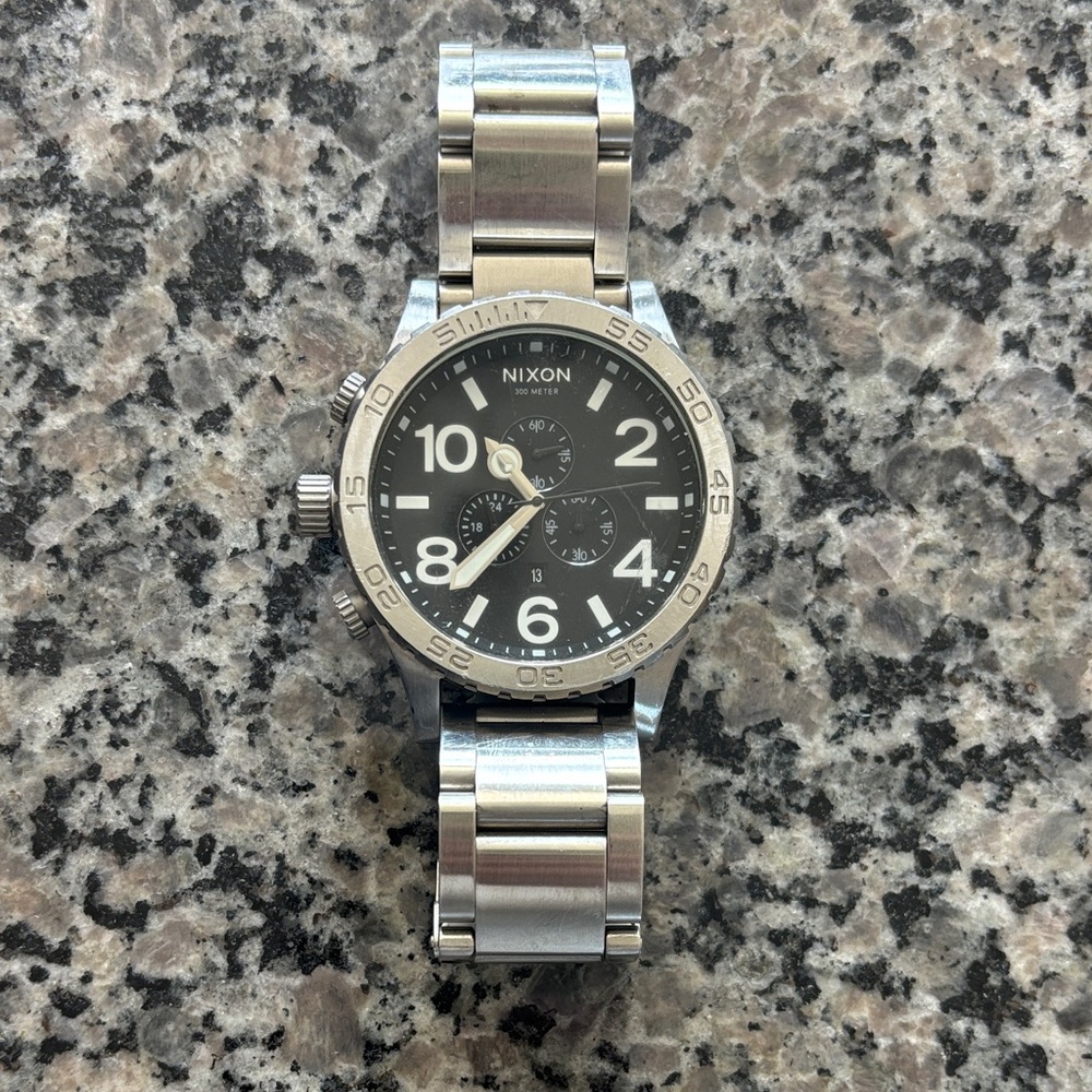 Nixon Silver Chronograph Watch with Black Dial